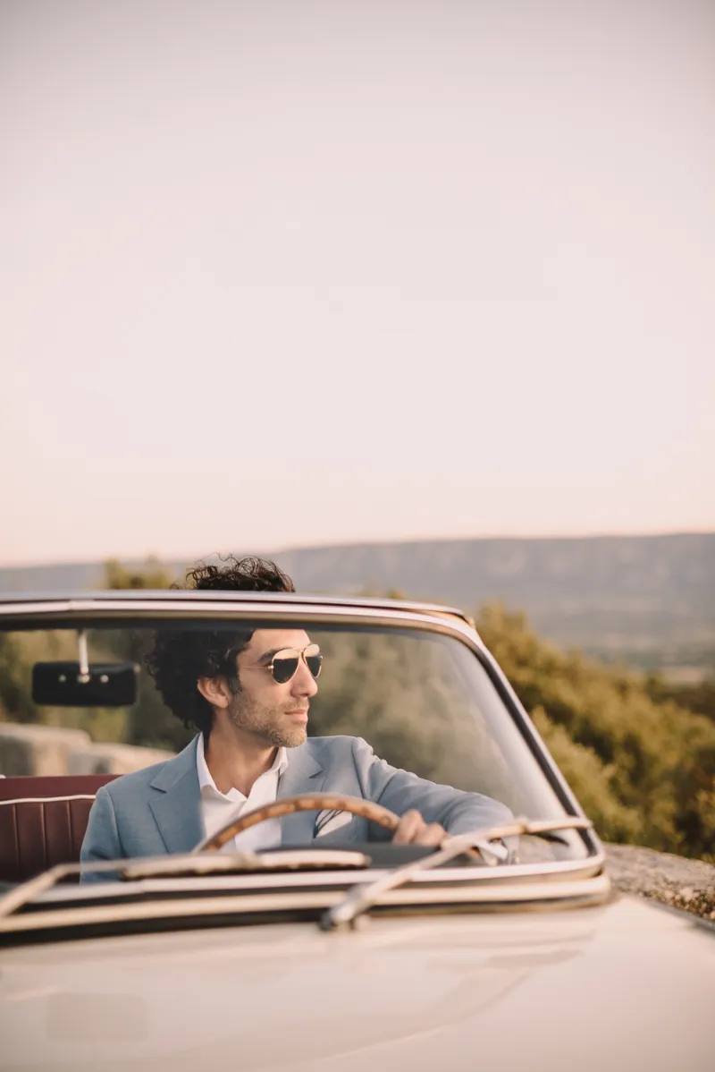 Provence groom driving wedding vintage car